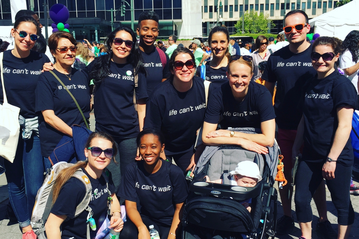 A dozen of SPEAR's Physical Therapists pose after walking across NYC's Brooklyn Bridge to raise funds for Arthritis research