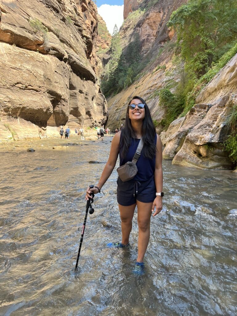 Jinal hiking in a river