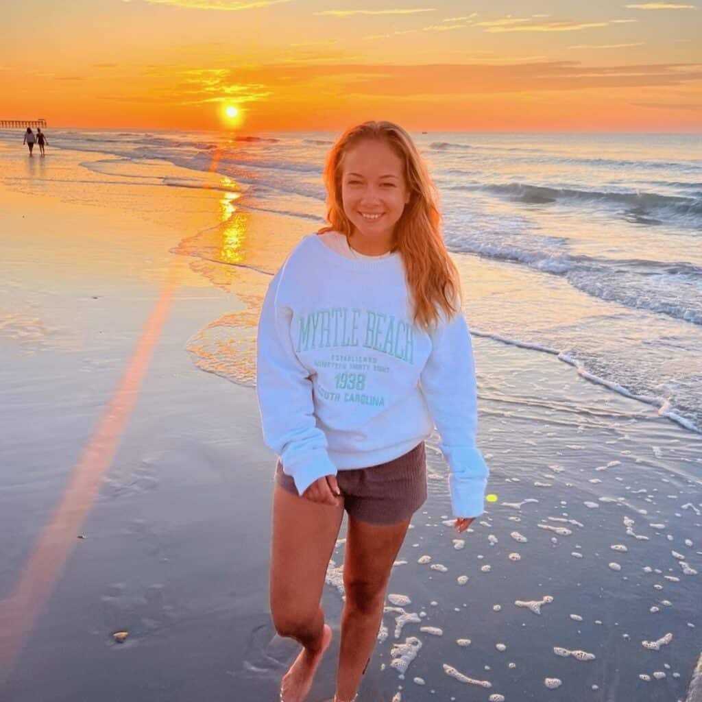 Alexandra Petersen walking on the beach