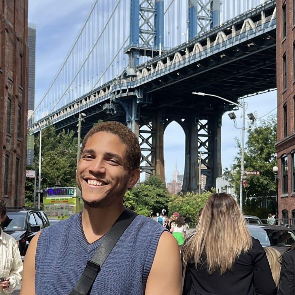 Soja Moore in front of the Dumbo bridge