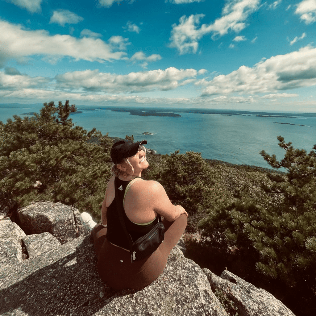 Julia Nappier looking at the ocean from the top of a mountain